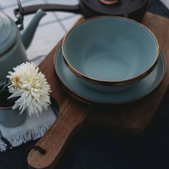 2 speckled seafoam green enamel bowls or soup plates